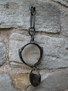 Jougs at the Base of the Tower