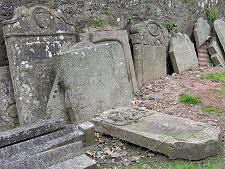 Old Gravestones Against Wall