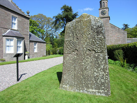The Front Face of the Manse Symbol Stone with the Old Manse on the Left and the Church in the Background
