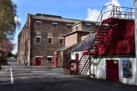 Distillery Exterior and Condenser Tank