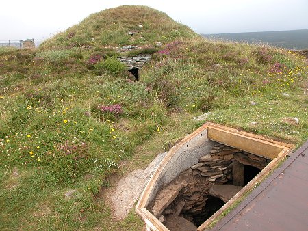 Taversoe Tuick Cairn from the South, with the Miniature Chamber in the Foreground and
the Original Entrance to the Lower Chamber in the Background