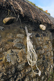 Stones Weighing Down the Thatch