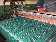 Undiscovered Scotland Tartan being woven at Andrew Elliot Ltd in Selkirk